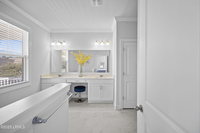 full bath featuring marble finish floor, ornamental molding, a sink, and visible vents