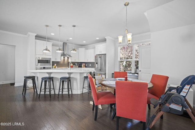 dining area featuring dark wood-style flooring, crown molding, and baseboards