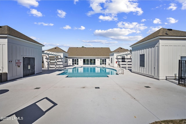 community pool with a patio and a pergola