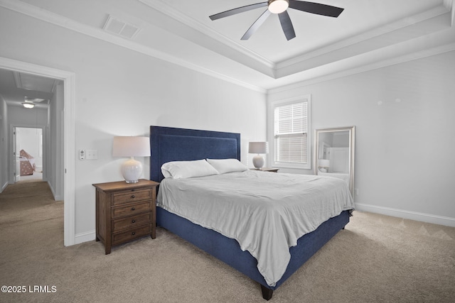 bedroom with light carpet, attic access, visible vents, a raised ceiling, and crown molding