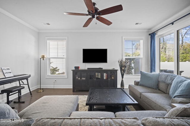 living room featuring baseboards, visible vents, ornamental molding, and dark wood-type flooring