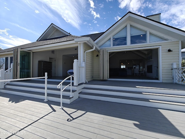 exterior space featuring roof with shingles