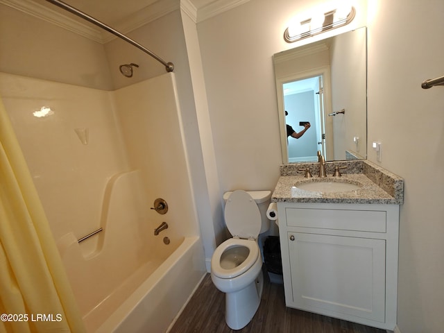 full bathroom with toilet, wood finished floors, crown molding, vanity, and washtub / shower combination