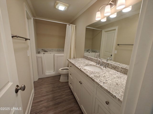 full bath featuring crown molding, vanity, toilet, and wood finished floors