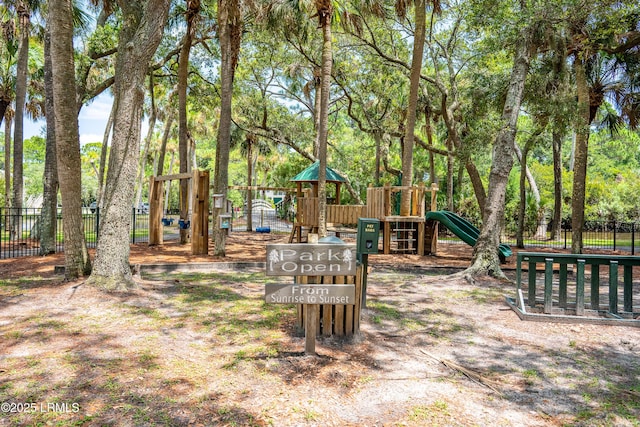 exterior space with playground community and fence