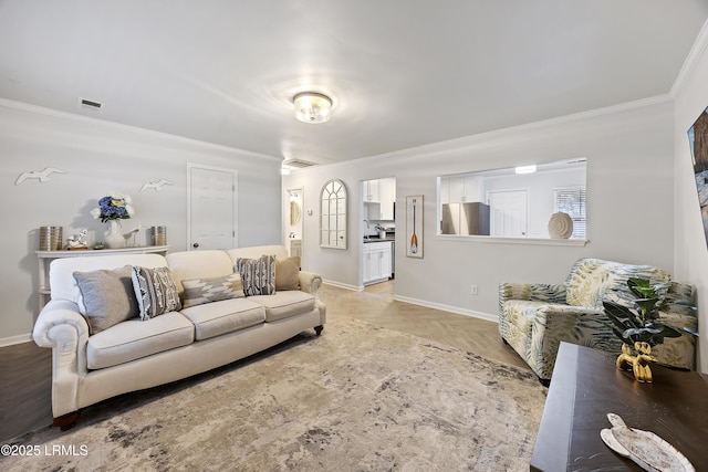 living room with crown molding and light parquet flooring