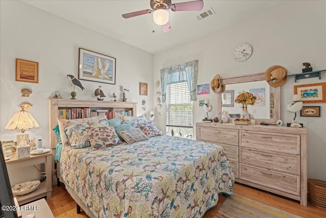 bedroom featuring ceiling fan and light wood-type flooring