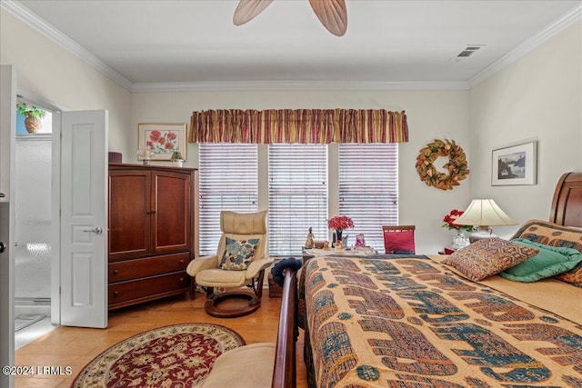 bedroom featuring ornamental molding, ceiling fan, and light hardwood / wood-style flooring