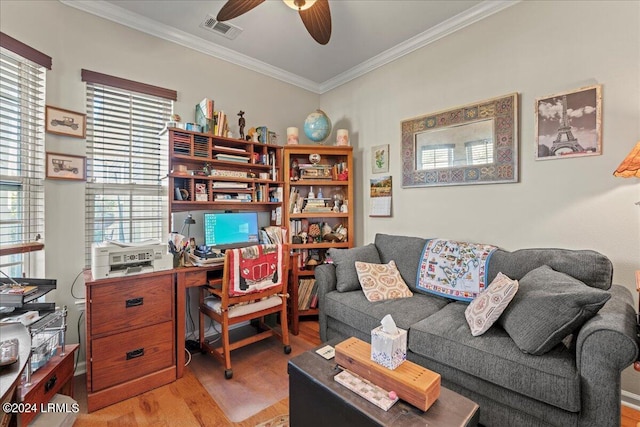 office with crown molding, ceiling fan, wood-type flooring, and a healthy amount of sunlight