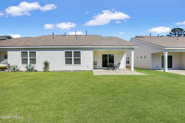 back of house with a yard and a patio area