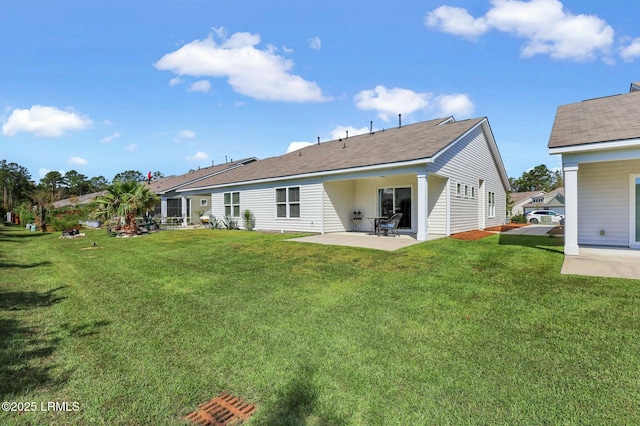 rear view of property with a patio area and a yard