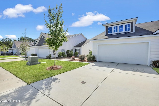 view of front of property with concrete driveway and a front lawn