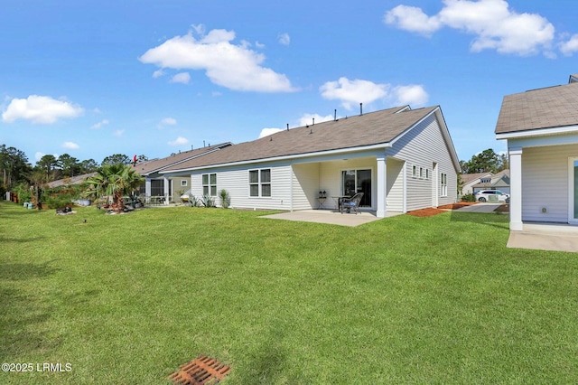 back of house featuring a yard and a patio