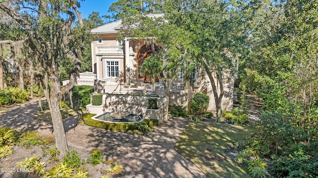 view of front of house featuring a balcony