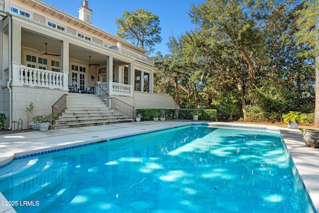 view of swimming pool with ceiling fan