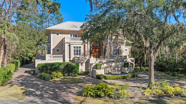 view of front of house with a balcony