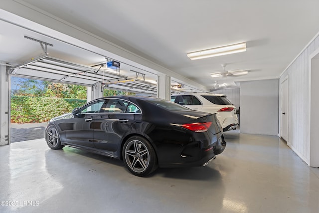 garage featuring a garage door opener and a carport