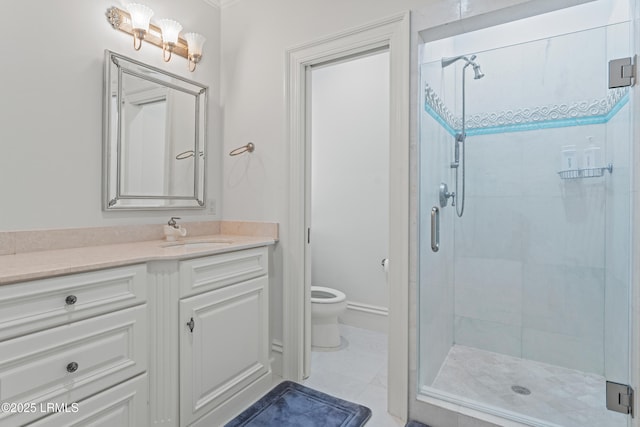 bathroom featuring vanity, a shower with shower door, tile patterned floors, and toilet