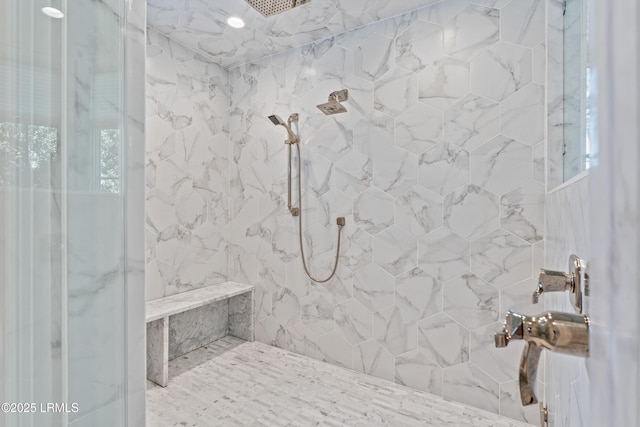 bathroom featuring a tile shower