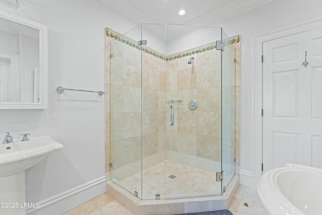 bathroom with ornamental molding, tile patterned floors, and independent shower and bath