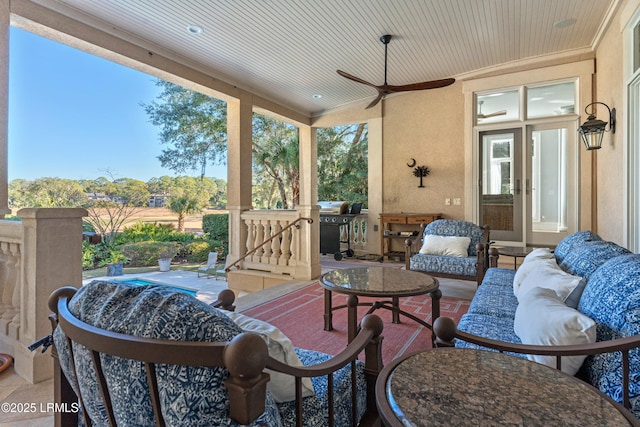 view of patio / terrace with an outdoor hangout area, ceiling fan, and an outdoor kitchen