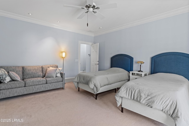 carpeted bedroom with ornamental molding and ceiling fan