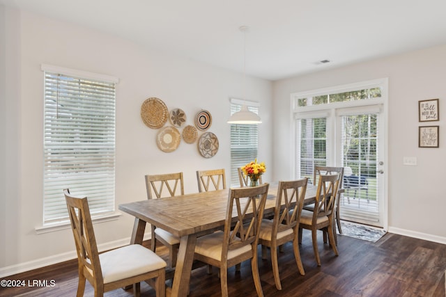 dining area with dark hardwood / wood-style floors