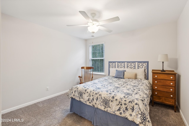 bedroom with dark colored carpet and ceiling fan