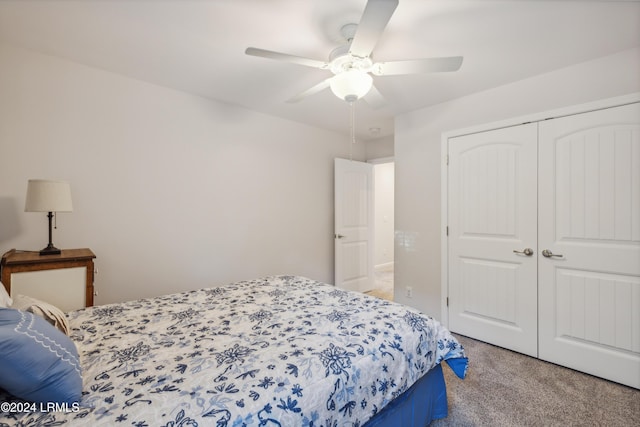 carpeted bedroom with ceiling fan and a closet