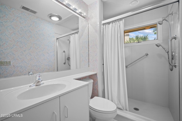 647 Island Cir E, Saint Helena Island, SC 29920 - bathroom featuring a shower with curtain, vanity, toilet, and wallpapered walls