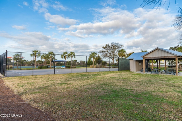 exterior space featuring fence, a lawn, and a gazebo