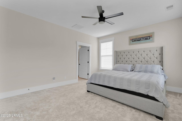 bedroom with visible vents, ceiling fan, light colored carpet, and baseboards