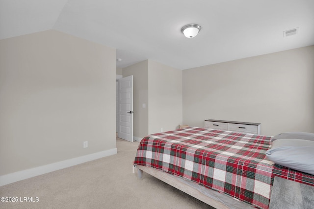 bedroom featuring light colored carpet, visible vents, and baseboards
