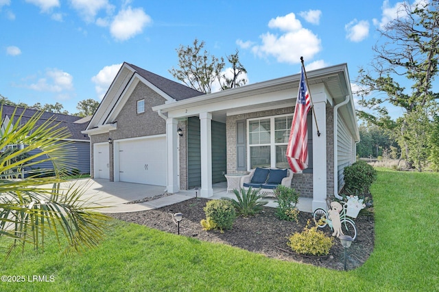 view of front of house featuring driveway, covered porch, a front yard, an attached garage, and brick siding