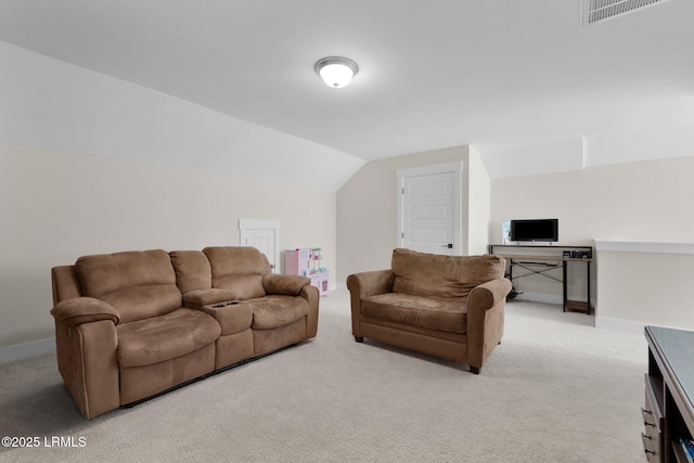carpeted living area featuring visible vents, vaulted ceiling, and baseboards
