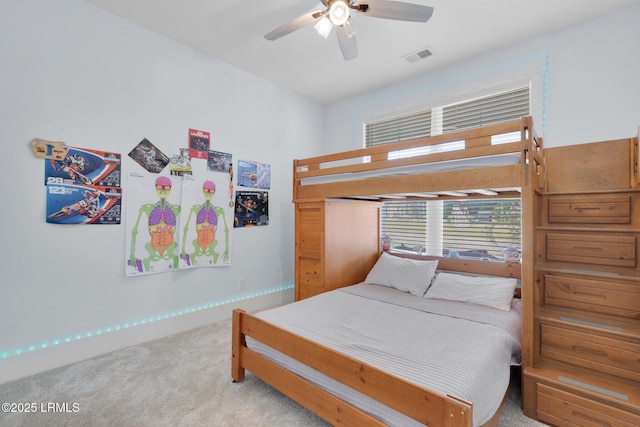 bedroom with a ceiling fan, visible vents, and carpet floors