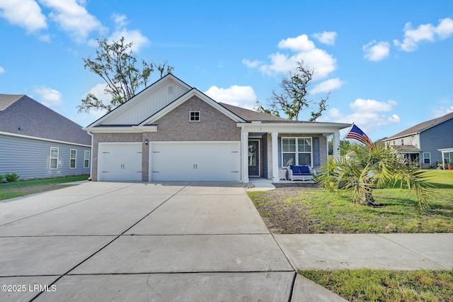 view of front of house with a garage, brick siding, covered porch, and concrete driveway
