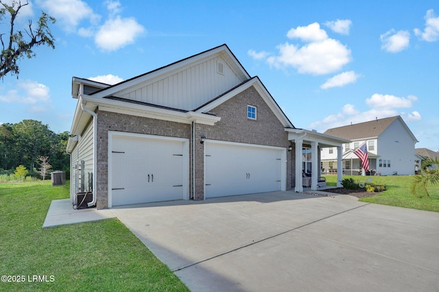 view of front of property featuring an attached garage, a front lawn, board and batten siding, and concrete driveway