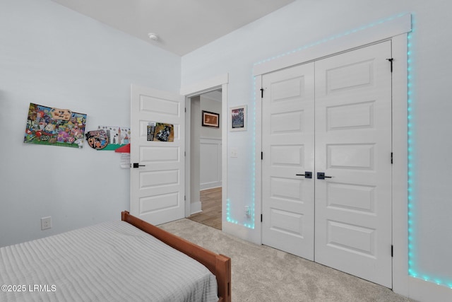 bedroom with a closet and carpet floors