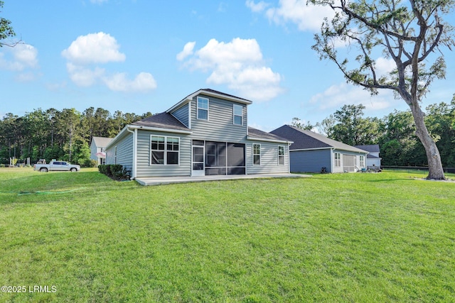 back of property featuring a sunroom and a yard