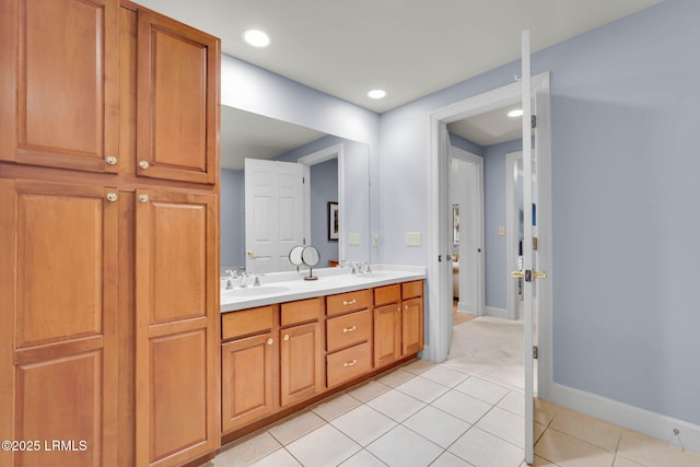 bathroom featuring tile patterned flooring and vanity