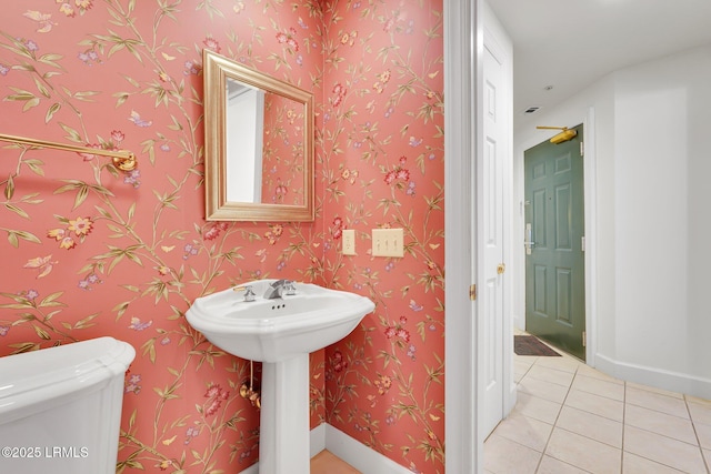 bathroom with tile patterned floors and toilet