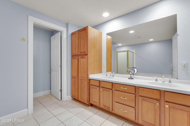 bathroom featuring vanity, tile patterned floors, and a shower with shower door