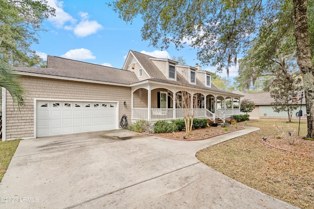 view of front of house with a chimney, a shingled roof, covered porch, concrete driveway, and a garage