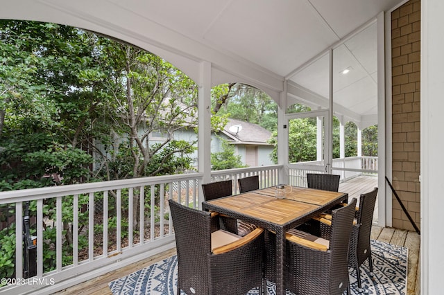 wooden terrace featuring outdoor dining space