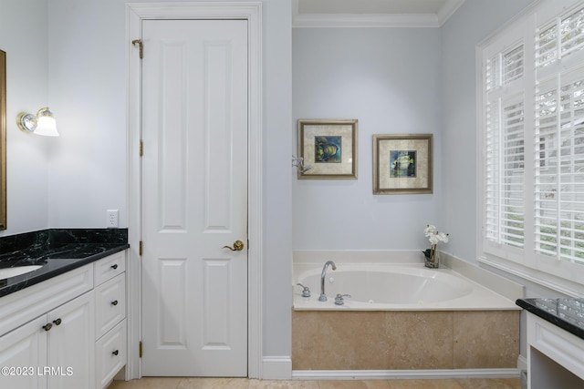 bathroom featuring ornamental molding, a bathing tub, and vanity