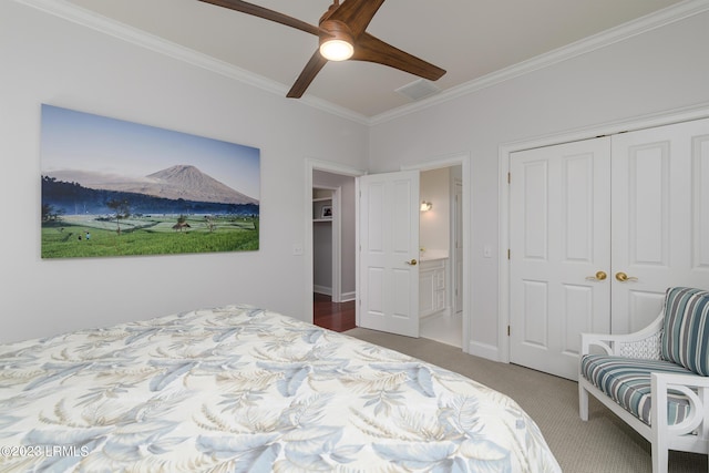 carpeted bedroom with crown molding, a closet, and ceiling fan