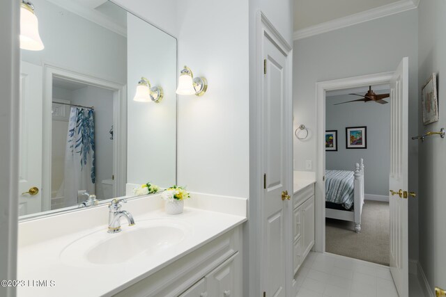 bathroom with vanity, ornamental molding, and curtained shower