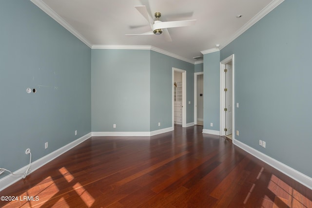 unfurnished room featuring dark wood-type flooring, ceiling fan, and ornamental molding