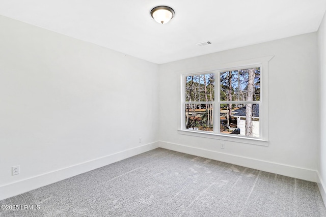 carpeted spare room with plenty of natural light